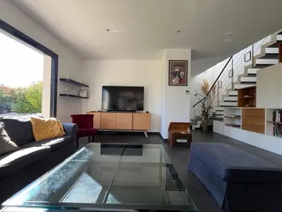 Coin salon dans l'établissement Villa spacieuse Amboise Piscine Jacuzzi 11 pers