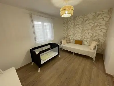 Un ou plusieurs lits dans un hébergement de l'établissement Gîte tranquille avec jardin à Savonnières - FR-1-381-634