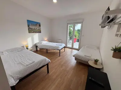 Un ou plusieurs lits dans un hébergement de l'établissement Appartement 10 personnes avec terrasse à Vallères