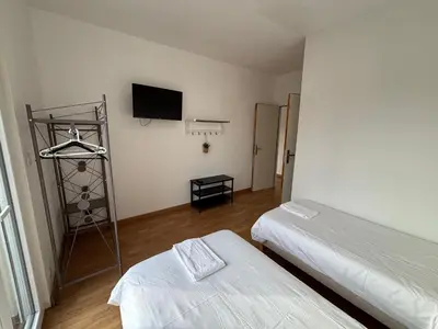 Un ou plusieurs lits dans un hébergement de l'établissement Appartement 10 personnes avec terrasse à Vallères