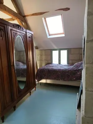 Un ou plusieurs lits dans un hébergement de l'établissement maison belle au bois dormant