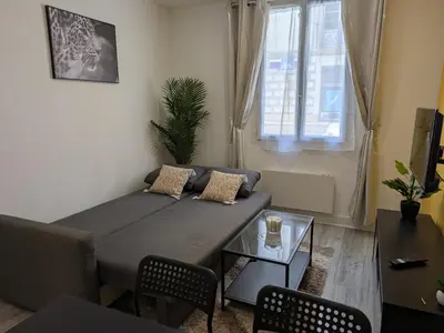 Coin salon dans l'établissement Appartement RDC Soleil
