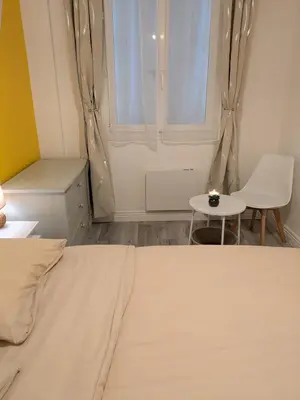 Un ou plusieurs lits dans un hébergement de l'établissement Appartement RDC Soleil