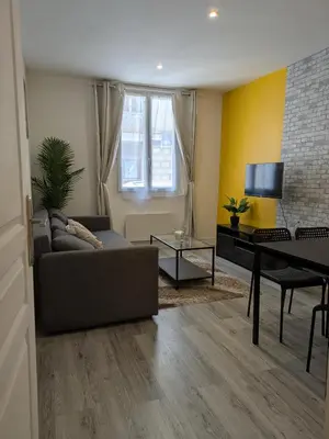Coin salon dans l'établissement Appartement RDC Soleil