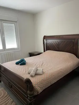 Un ou plusieurs lits dans un hébergement de l'établissement Appartement sympathique