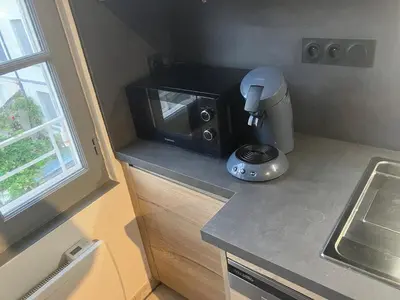 Cuisine ou kitchenette dans l'établissement Grand appartement centre ville château St Pierre