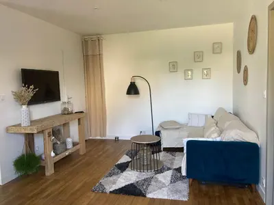 Télévision ou salle de divertissement dans l'établissement Maison de ville