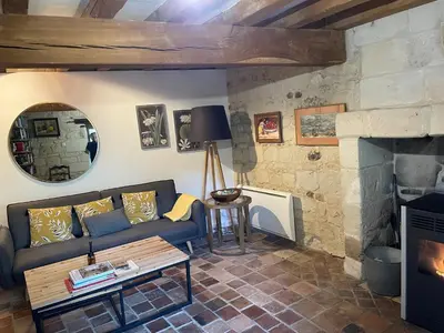 Coin salon dans l'établissement Abbaye Cottage - Maison entière - jardin - jacuzzi