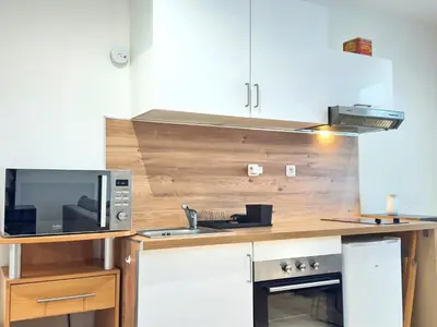 Cuisine ou kitchenette dans l'établissement L'Escapade du Port