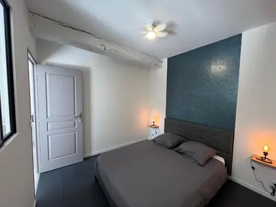 Un ou plusieurs lits dans un hébergement de l'établissement Gîte Les 4 Terres - Maison 1 chambre
