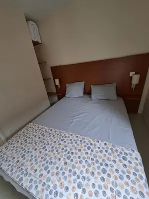 Un ou plusieurs lits dans un hébergement de l'établissement cottage Le Vau15