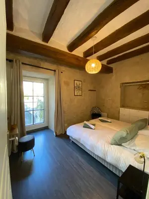 Un ou plusieurs lits dans un hébergement de l'établissement Appartement de charme L'écrin du Castel Classé 3 étoiles