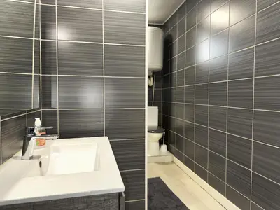 Salle de bains dans l'établissement Le Beige