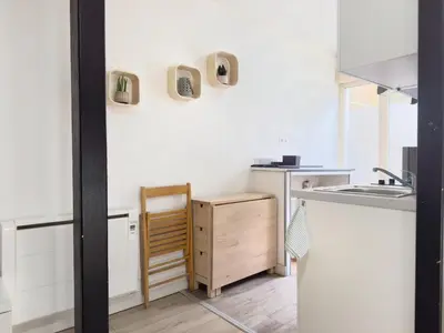 Cuisine ou kitchenette dans l'établissement Le Beige