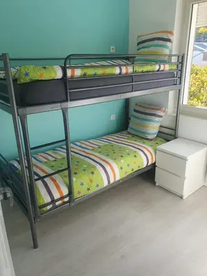 Un ou plusieurs lits dans un hébergement de l'établissement Maison agreable