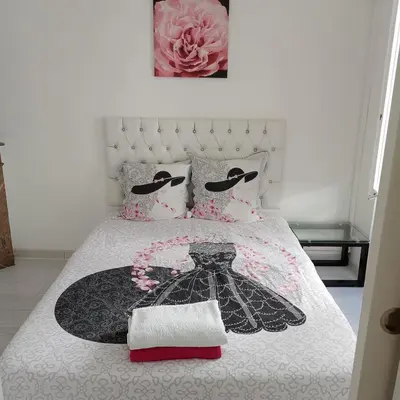Un ou plusieurs lits dans un hébergement de l'établissement Maison agreable