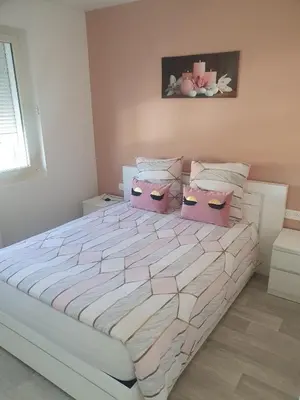 Un ou plusieurs lits dans un hébergement de l'établissement Maison agreable
