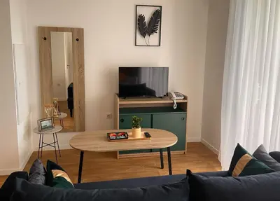 Télévision ou salle de divertissement dans l'établissement Zenao Appart'hôtels Tours
