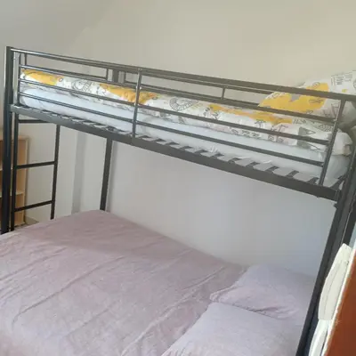Un ou plusieurs lits dans un hébergement de l'établissement MAISON spacieuse