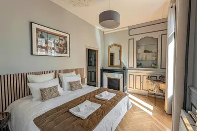Un ou plusieurs lits dans un hébergement de l'établissement Le Balcon de la Joconde - PrestiPlace Collection