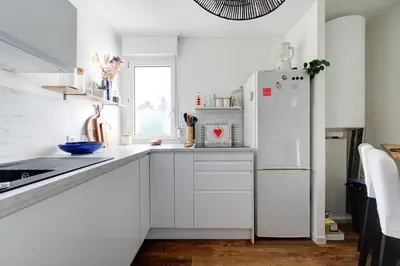 Cuisine ou kitchenette dans l'établissement Appartement Cocooning