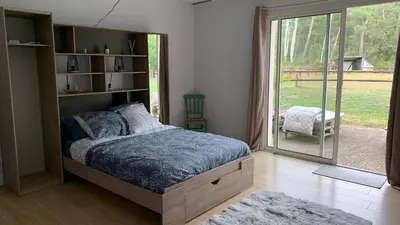 Un ou plusieurs lits dans un hébergement de l'établissement Chambre d'Hotes au Haras des Fenucy