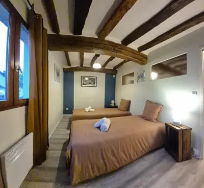Un ou plusieurs lits dans un hébergement de l'établissement Maison plein centre