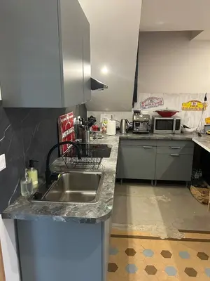Cuisine ou kitchenette dans l'établissement Maison 1930 Familiale à la Marbellière, 2 chambres