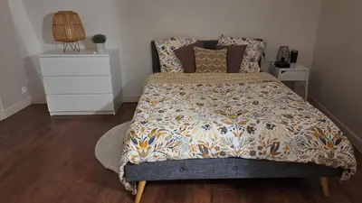 Un ou plusieurs lits dans un hébergement de l'établissement Jolie chambre en cœur de ville
