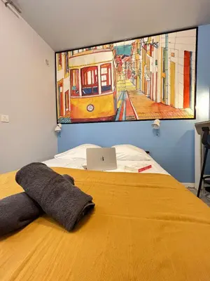 Un ou plusieurs lits dans un hébergement de l'établissement Studio Lisbonne - Plein centre-ville refait à neuf avec parking gratuit