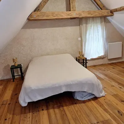Un ou plusieurs lits dans un hébergement de l'établissement Gîte de la douce évasion