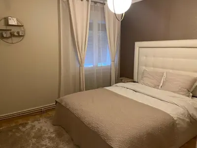 Un ou plusieurs lits dans un hébergement de l'établissement Maison Chic à 10min du circuit des 24H
