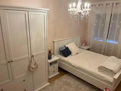 Un ou plusieurs lits dans un hébergement de l'établissement Maison Chic à 10min du circuit des 24H