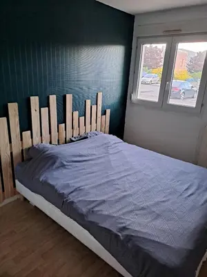 Un ou plusieurs lits dans un hébergement de l'établissement Appartement Proche Gare et Circuit 24h