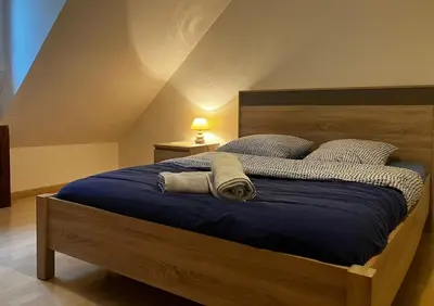 Un ou plusieurs lits dans un hébergement de l'établissement Au bois de la Belle
