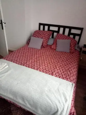 Un ou plusieurs lits dans un hébergement de l'établissement Chambre pour une personne chez l'habitant