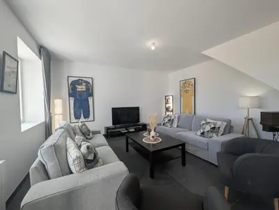 Télévision ou salle de divertissement dans l'établissement La Maison des Vergers