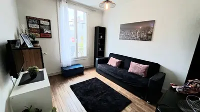 Coin salon dans l'établissement Cozy apartment, close to Gare du Mans