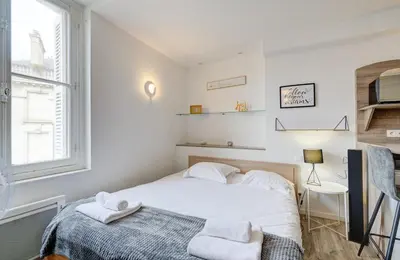 Un ou plusieurs lits dans un hébergement de l'établissement Studio - Plein Coeur du Centre Ville - Wifi