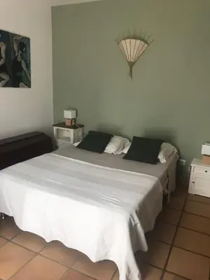 Un ou plusieurs lits dans un hébergement de l'établissement Jolie maison provençale