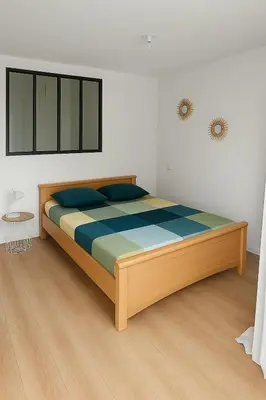 Un ou plusieurs lits dans un hébergement de l'établissement Grand Studio entier proche de Tours