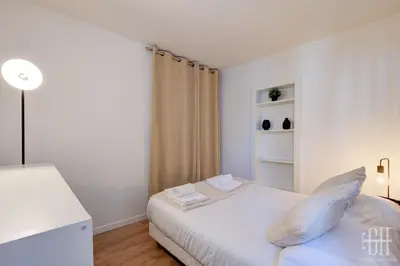Un ou plusieurs lits dans un hébergement de l'établissement Appartement -Quartier Historique - Hyper Centre