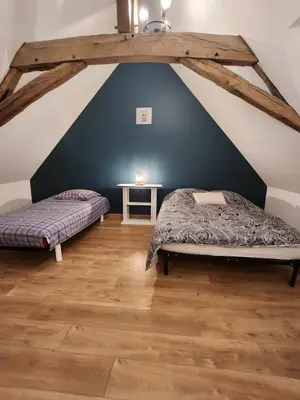 Un ou plusieurs lits dans un hébergement de l'établissement Maison de campagne
