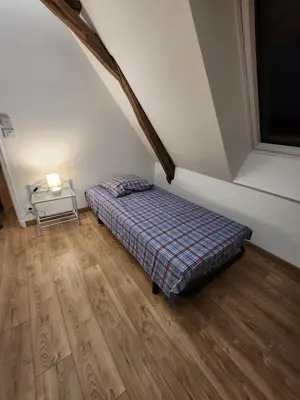 Un ou plusieurs lits dans un hébergement de l'établissement Maison de campagne