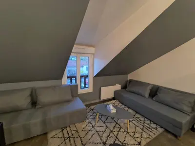 Coin salon dans l'établissement Appartement La cabane perchée 9 personnes wifi