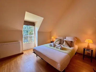 Un ou plusieurs lits dans un hébergement de l'établissement Maison de campagne de charme