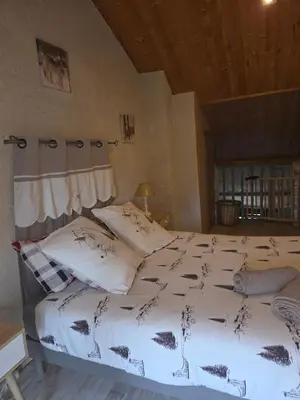 Un ou plusieurs lits dans un hébergement de l'établissement La tanière du loup