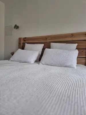 Un ou plusieurs lits dans un hébergement de l'établissement Les chambres de Marcel