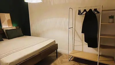 Un ou plusieurs lits dans un hébergement de l'établissement Le 10 du NC - Appartement cosy