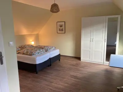 Un ou plusieurs lits dans un hébergement de l'établissement B&B L'Atout de France